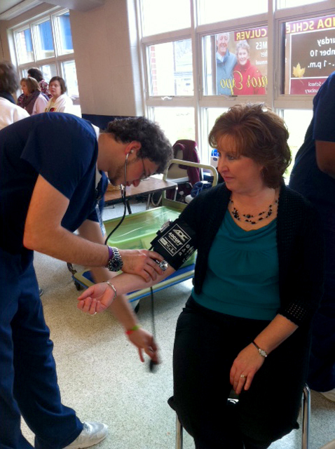 Representative Lynda Culver has her blood pressure taken at the 2012 Senior Expo