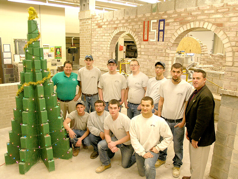 Masonry 2012 Students Pose with Class Christmas Tree