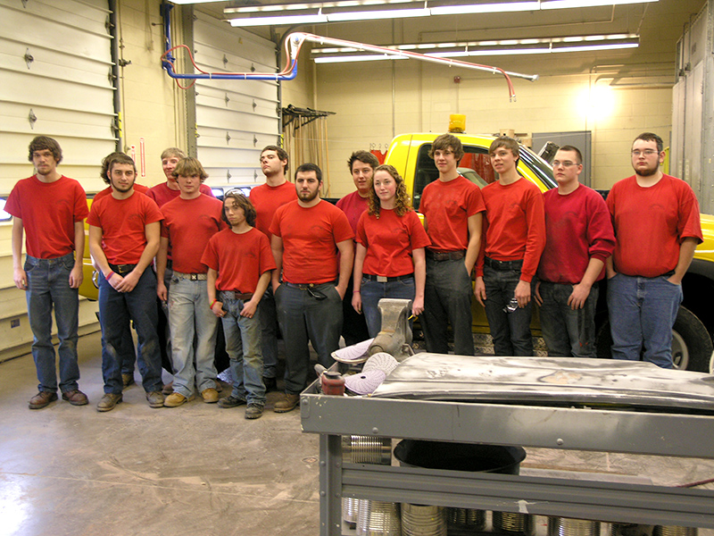 Collision Repair students pose with a completed project for the city of Sunbury.