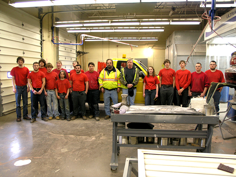 Collision Repair students pose with representatives of the City of Sunbury.