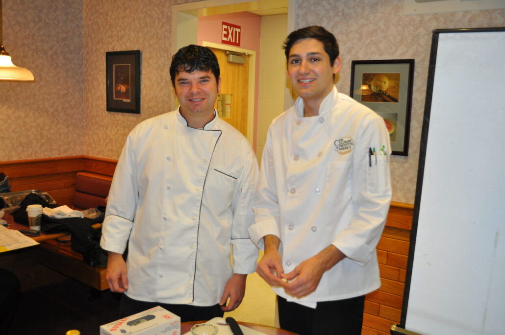 Food Service instructor Justin Wright (left) and Giovanni Ray (right) from the Culinary Institute of America