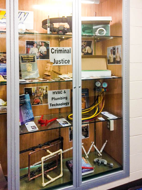 A display case at Mifflinburg features SUN Tech's Criminal Justice and HVAC programs.