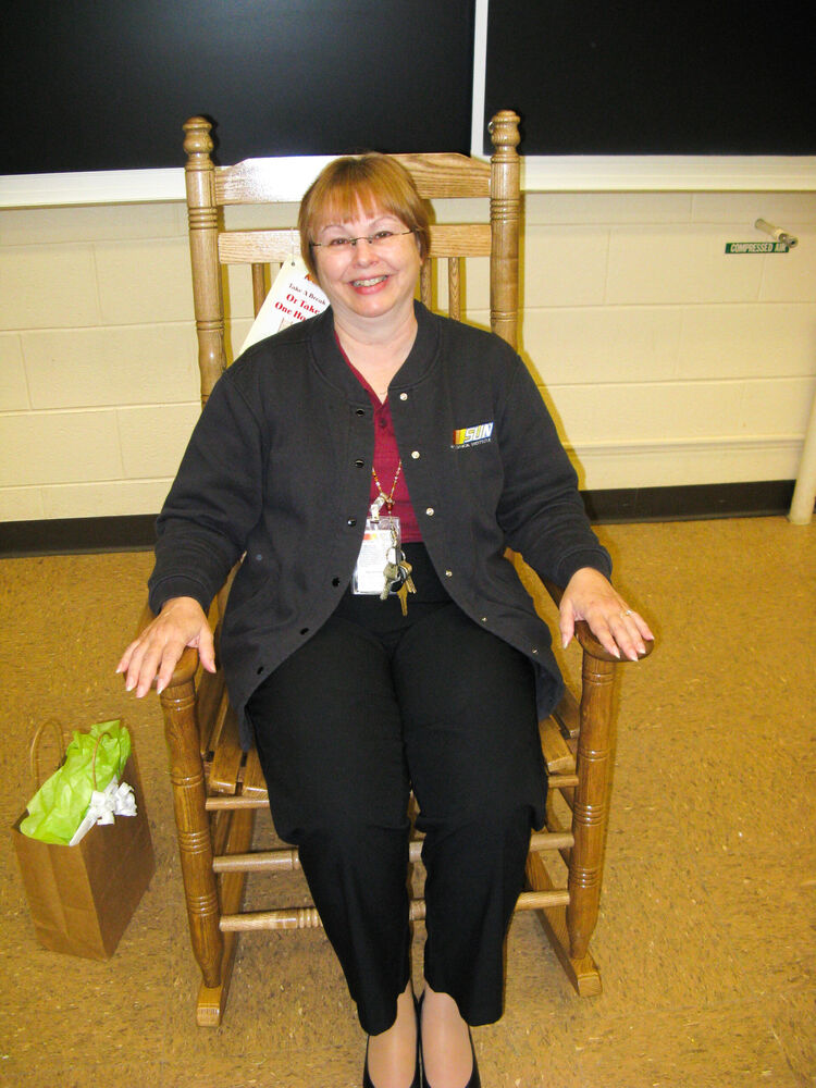 Mrs. Sharer enjoys the rocking chair she received for her time at SUN Tech.