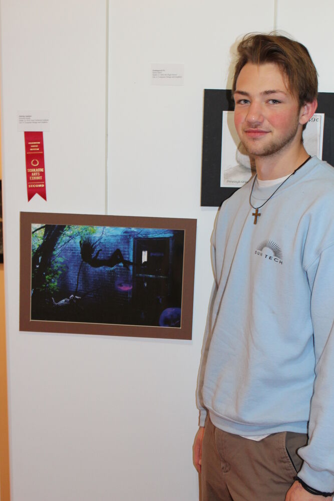 Nick Smith with his Scholastic Art 2nd place award winning computer design and graphics artwork at the Packwood House Museum. 